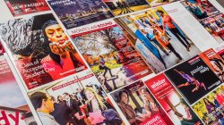 Spread of various publications and marketing materials designed by University Communications.
