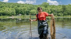 Montclair State University student in knee-deep waters