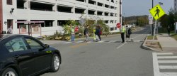 Picture of crossing guards and students at the Car Parc Diem crosswalk.