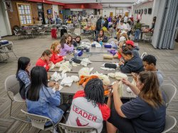 Students drawing and volunteering at the 9/11 Day of Service.