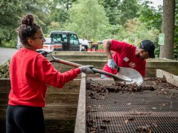 Two students with a shovel on 9/11 Day of Service