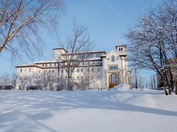 University Hall and nearby campus area in snow.
