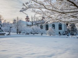 College Hall and nearby campus area in snow.