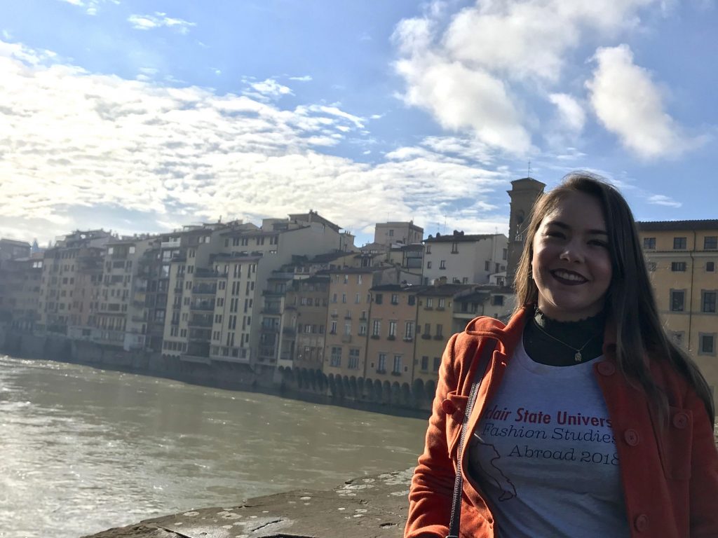 Student posing on pedestran bridge in Wolfersberger